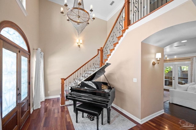 457 Boone Ln, Fairhope, AL 36532 - foyer featuring french doors, stairway, wood finished floors, arched walkways, and a chandelier