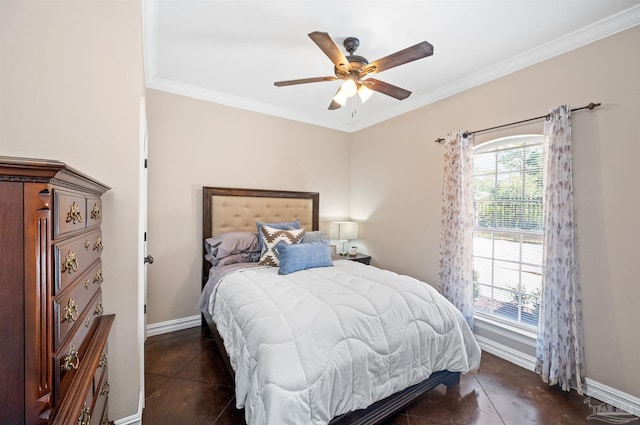 bedroom featuring dark tile patterned floors, ornamental molding, and ceiling fan