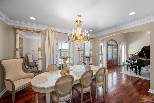 457 Boone Ln, Fairhope, AL 36532 - dining area featuring arched walkways, a chandelier, dark wood-style floors, crown molding, and baseboards