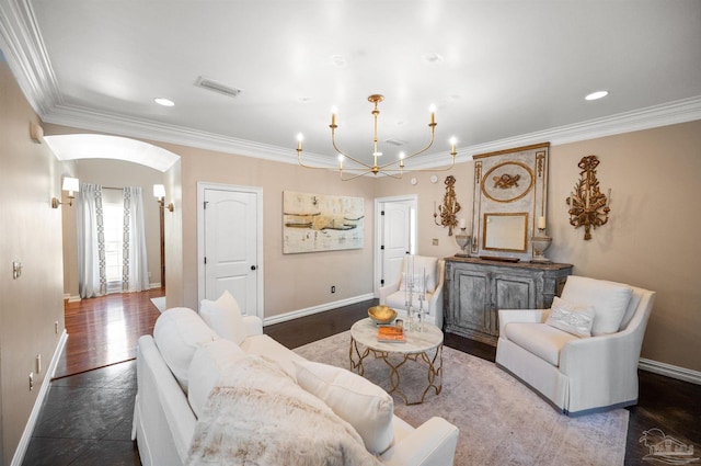 living room with crown molding, a chandelier, and wood-type flooring