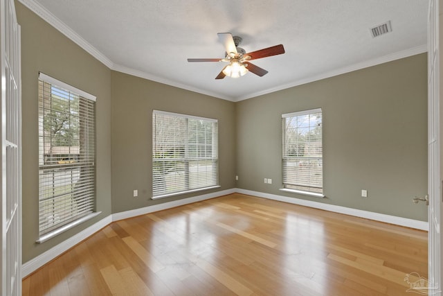 empty room with ceiling fan, a textured ceiling, and light hardwood / wood-style flooring