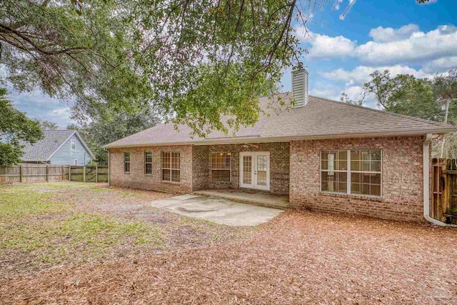 rear view of property featuring french doors and a patio