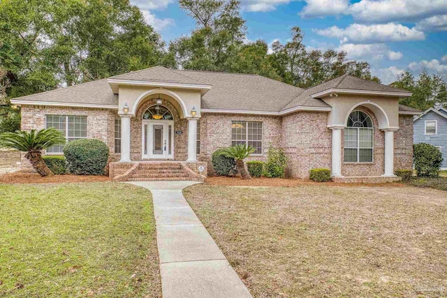 view of front of home with a front lawn