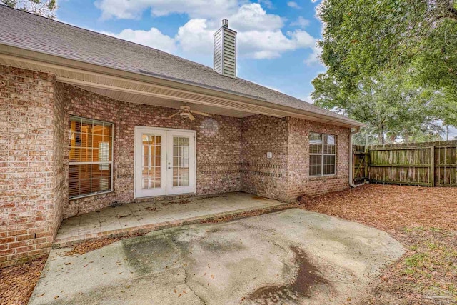 rear view of property with french doors and a patio