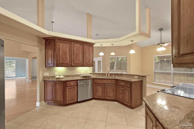 kitchen featuring ceiling fan, dishwasher, pendant lighting, kitchen peninsula, and sink