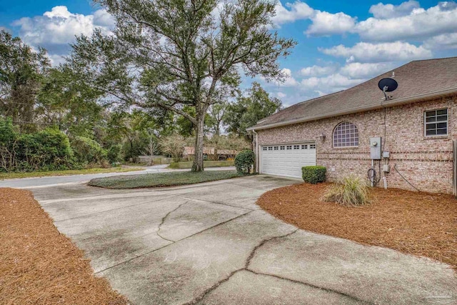 view of side of property with a garage