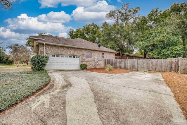 view of side of home featuring a garage