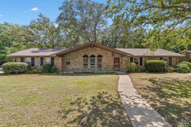 3481 Summit Blvd, Pensacola, FL 32503 - ranch-style home featuring brick siding and a front yard
