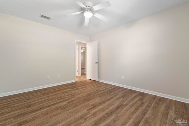 3481 Summit Blvd, Pensacola, FL 32503 - empty room with wood finished floors, a ceiling fan, and baseboards