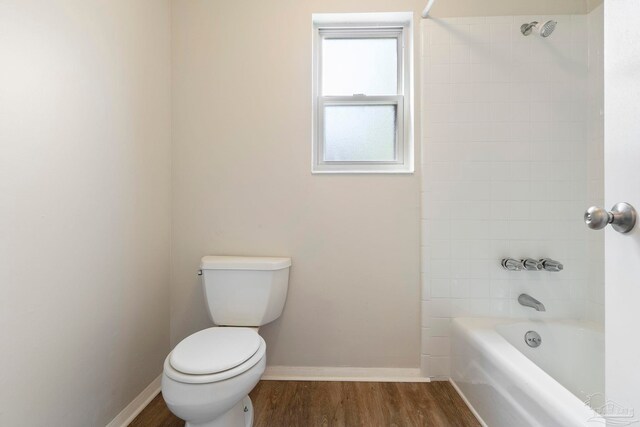 3481 Summit Blvd, Pensacola, FL 32503 - full bath featuring toilet, bathing tub / shower combination, wood finished floors, and baseboards