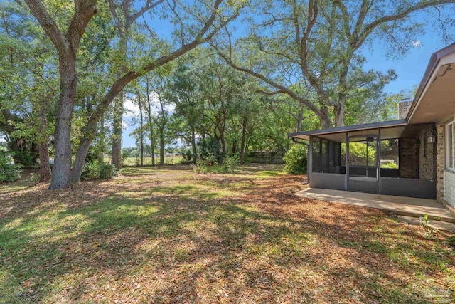 3481 Summit Blvd, Pensacola, FL 32503 - view of yard with a sunroom