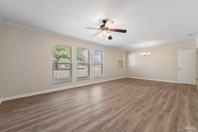 3481 Summit Blvd, Pensacola, FL 32503 - spare room with crown molding, a ceiling fan, a chandelier, wood finished floors, and a textured ceiling