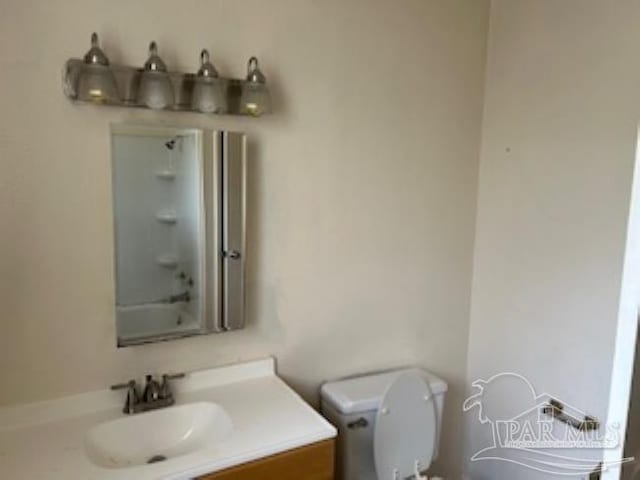bathroom with toilet, walk in shower, a washtub, and vanity