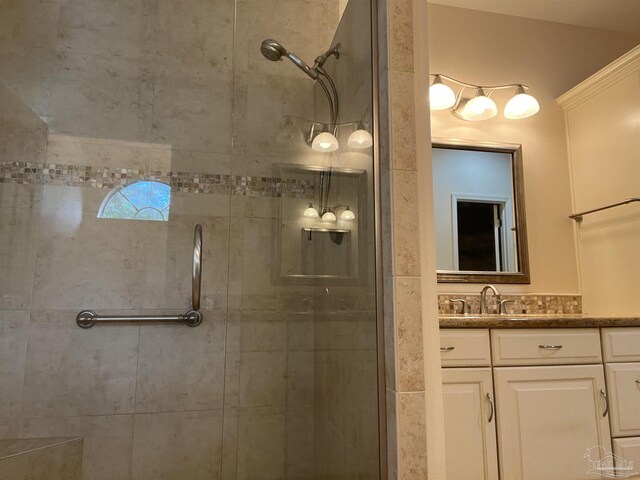 bathroom with vanity and a shower stall