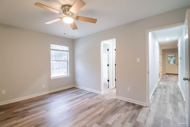 unfurnished room with ceiling fan and light hardwood / wood-style floors