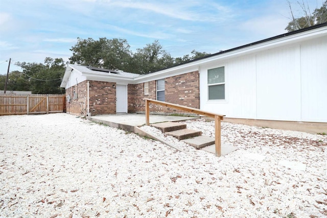 view of side of property with a patio