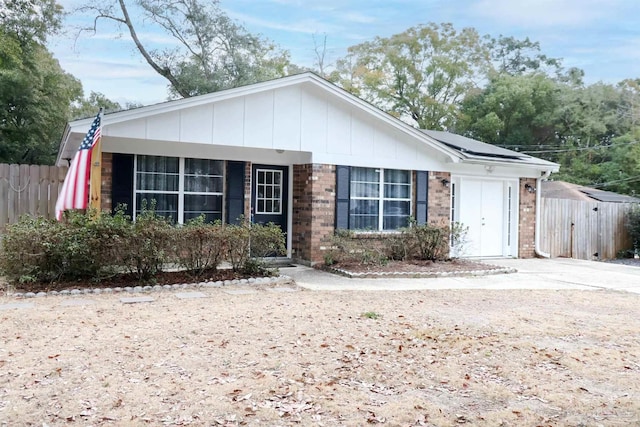 view of front of property with solar panels