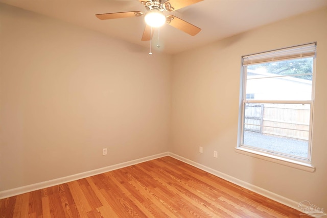 empty room with ceiling fan and light wood-type flooring