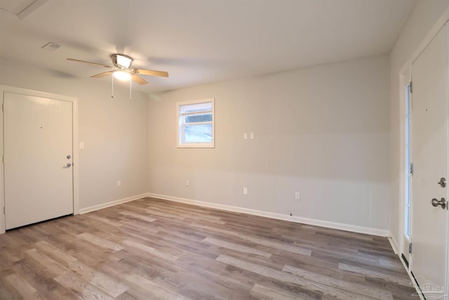 unfurnished room featuring hardwood / wood-style flooring and ceiling fan