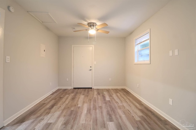 empty room with ceiling fan and light wood-type flooring