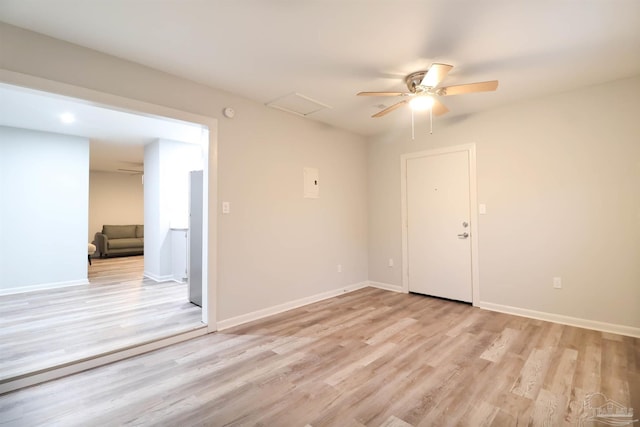 empty room featuring ceiling fan and light wood-type flooring