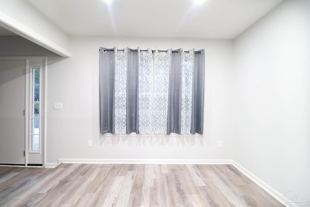 unfurnished room featuring light hardwood / wood-style flooring