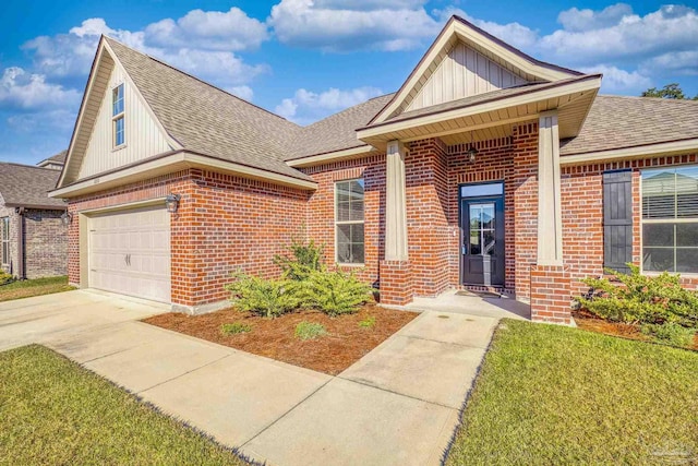 view of front of house featuring a front yard and a garage