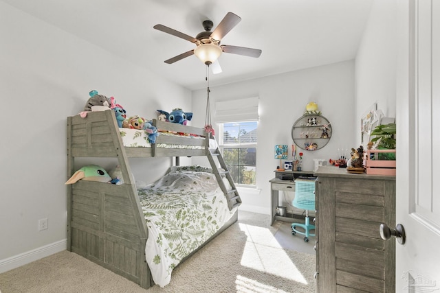 bedroom with ceiling fan and light carpet