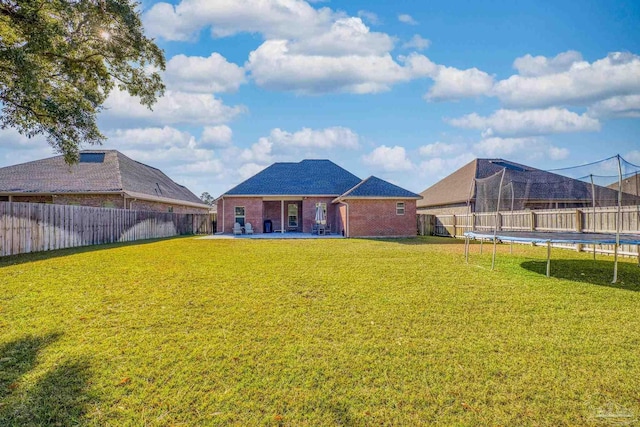 view of yard with a patio area and a trampoline