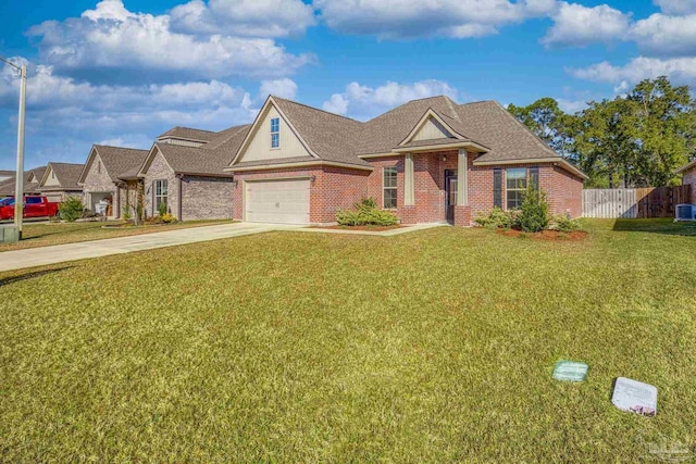 view of front of house featuring a garage and a front yard