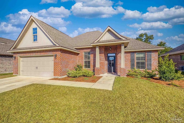 view of front of home featuring a garage and a front lawn