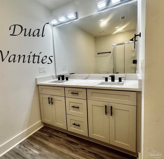 bathroom with vanity, wood-type flooring, and a shower with shower door