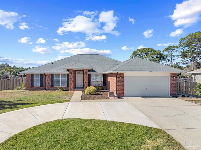 1933 Eagle Ln, Navarre, FL 32566 - ranch-style home with an attached garage, concrete driveway, brick siding, and roof with shingles