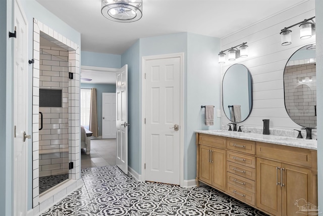 1933 Eagle Ln, Navarre, FL 32566 - full bathroom with double vanity, a shower stall, and tile patterned flooring