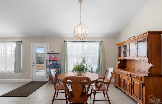 1933 Eagle Ln, Navarre, FL 32566 - dining area featuring a chandelier and light tile patterned floors