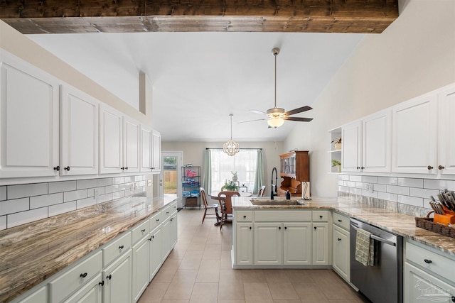 1933 Eagle Ln, Navarre, FL 32566 - kitchen with stainless steel dishwasher, tasteful backsplash, light tile patterned floors, a ceiling fan, and white cabinets