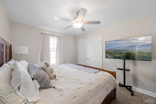1933 Eagle Ln, Navarre, FL 32566 - bedroom featuring ceiling fan, a closet, and tile patterned floors