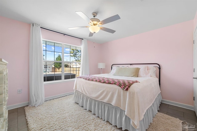 1933 Eagle Ln, Navarre, FL 32566 - bedroom with tile patterned flooring and a ceiling fan