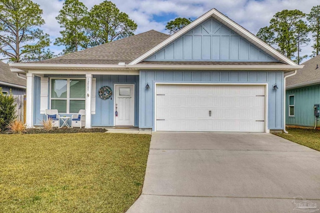 view of front facade with a garage and a front yard