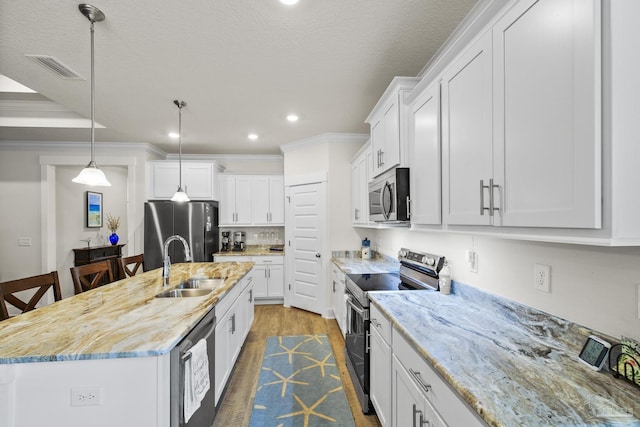 kitchen with white cabinetry, sink, an island with sink, and appliances with stainless steel finishes