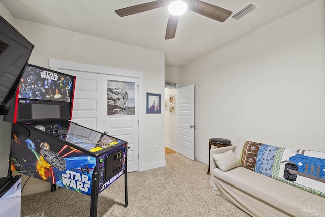 playroom with ceiling fan and carpet flooring