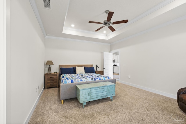 carpeted bedroom featuring crown molding, ceiling fan, and a tray ceiling