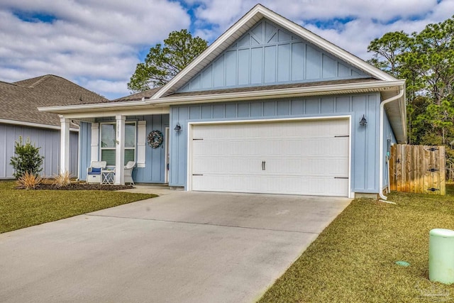 view of front facade featuring a garage and a front lawn