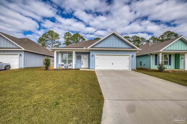 view of front of home with a garage and a front lawn