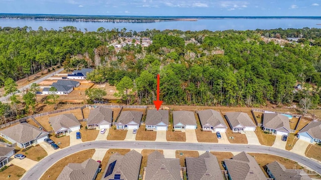 birds eye view of property with a water view