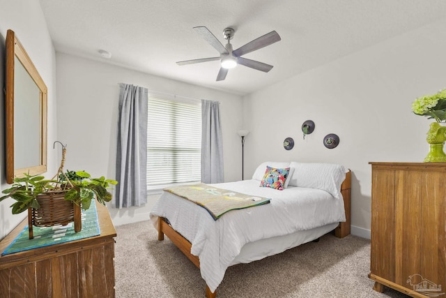 bedroom featuring ceiling fan and carpet flooring