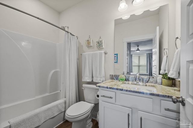 full bathroom featuring vanity, toilet, and shower / tub combo