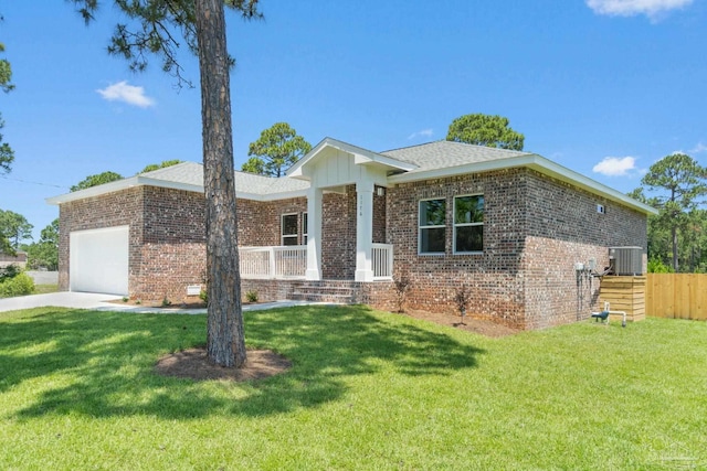 view of front of property with covered porch, central AC, a garage, and a front lawn