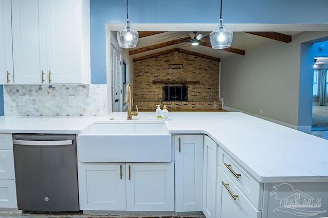 kitchen with dishwasher, white cabinets, sink, lofted ceiling with beams, and decorative light fixtures