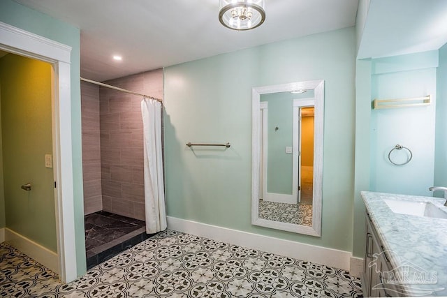 bathroom featuring tile patterned flooring, vanity, and a shower with curtain